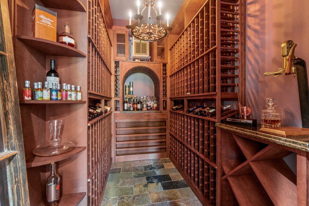Elegant wine cellar featuring handcrafted wood cabinetry