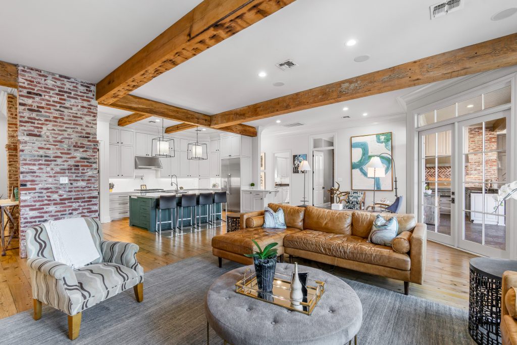 Warm luxury living room opening into the kitchen