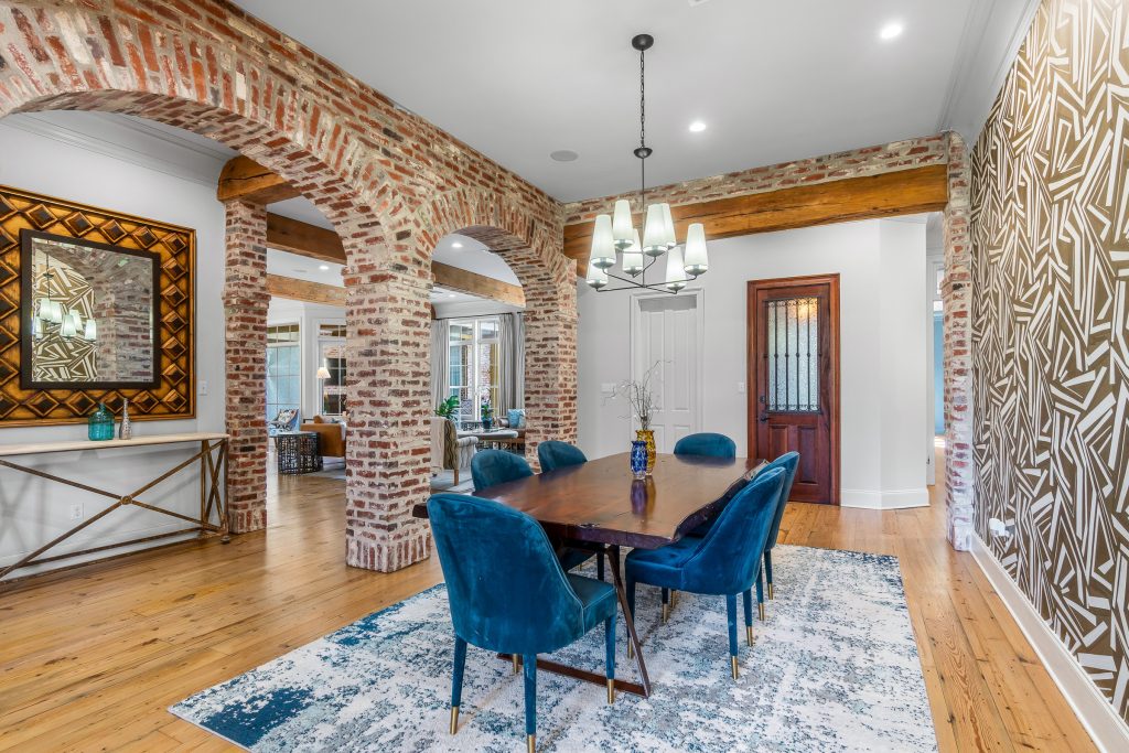 Luxury dining room with brick archways and elegant architectural details