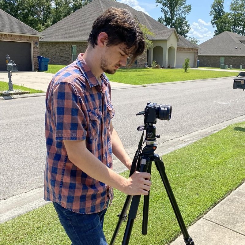 Hudson Hodges photographing a Baton Rouge home